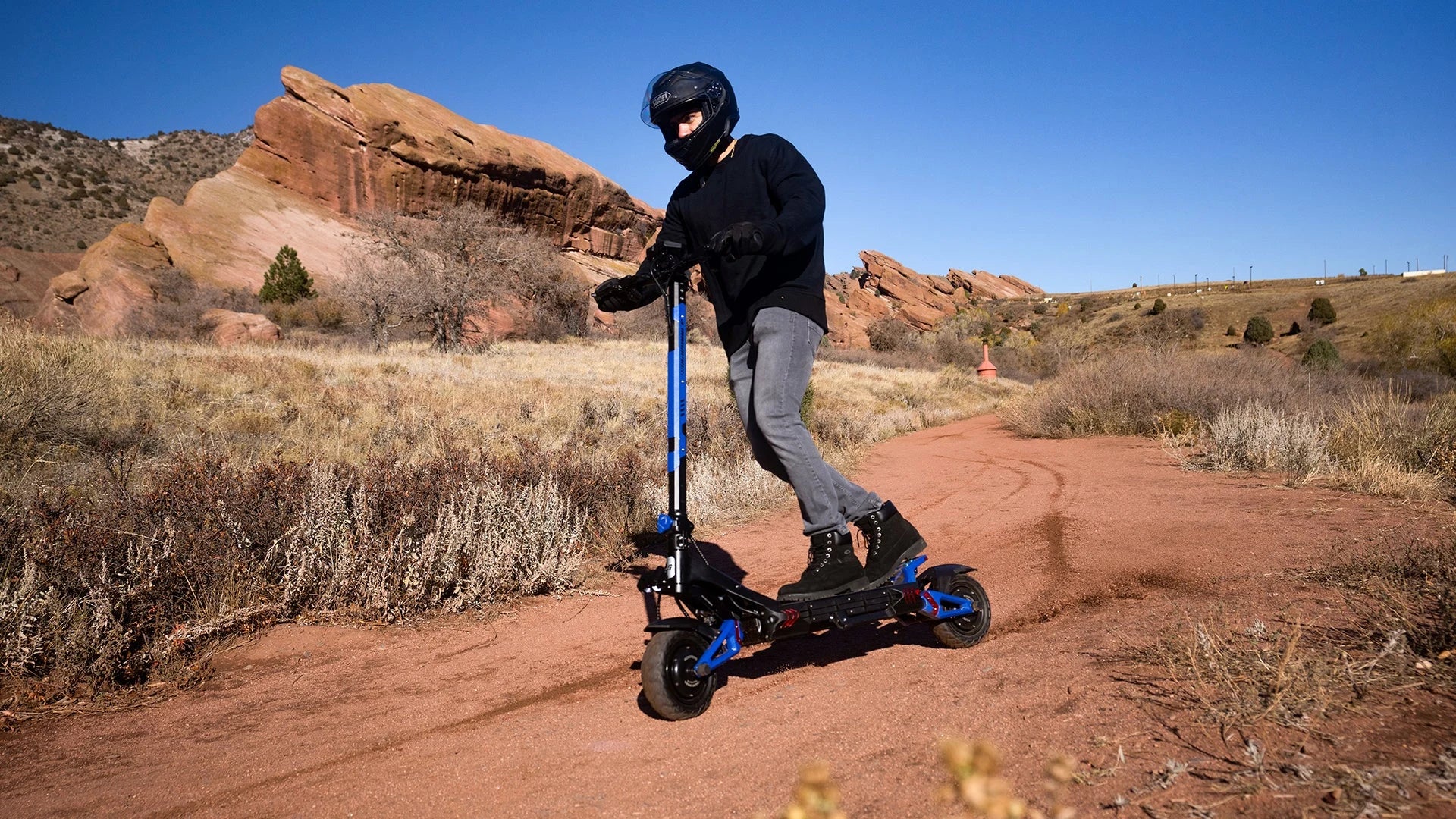 Helmeted RoadRunner rider exploring the trails near Denver